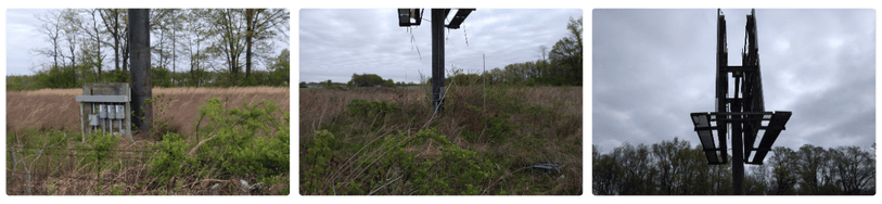 Unmaintained billboard structures in rural area showing overgrowth and missing creative, used for out-of-home advertising condition audits